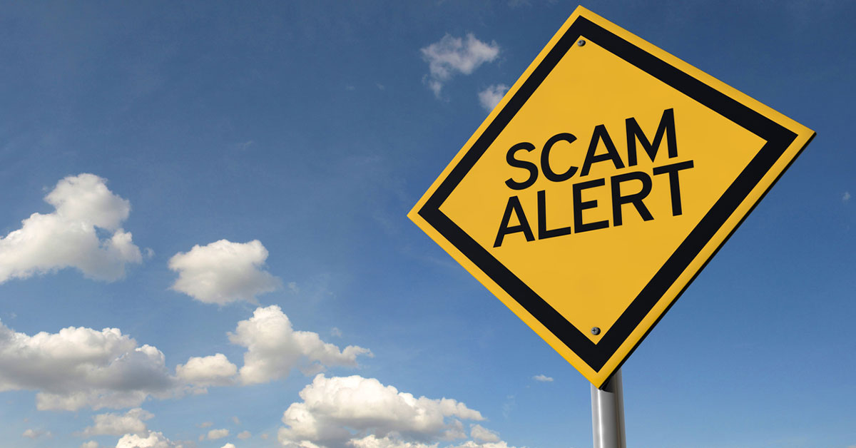 still image of a clear blue sky with a yellow highway sign with the words "scam alert".